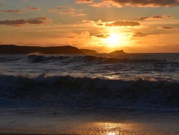 An image of the Cornish beach at sunset